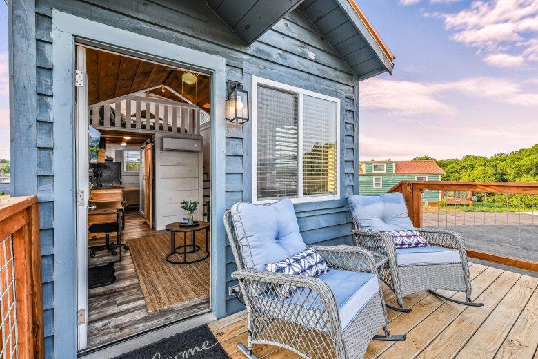 outdoor chairs on tiny home deck with mountain view