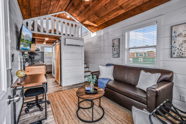 living room inside smoky mountains tiny home with couch and table